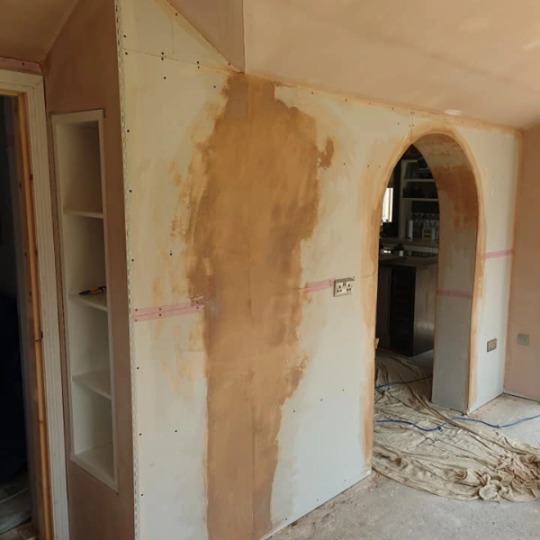 A tall area of plaster that has been repaired